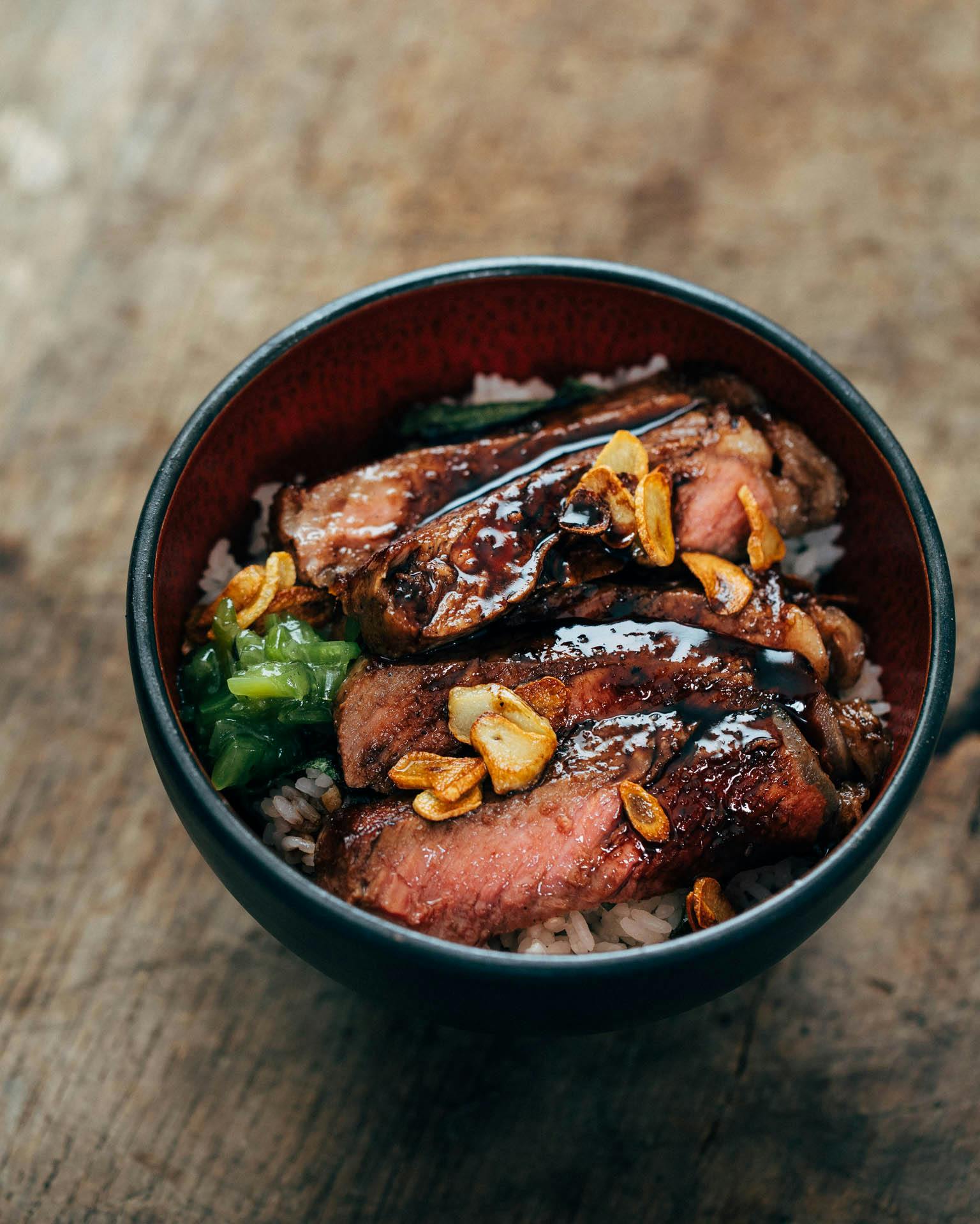 elevate your rice bowls with this ribeye steak donburi topped with
