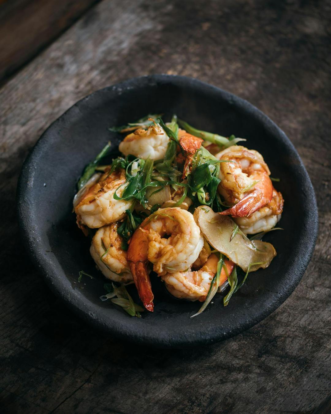 Wok-fried prawns with ginger and spring onion